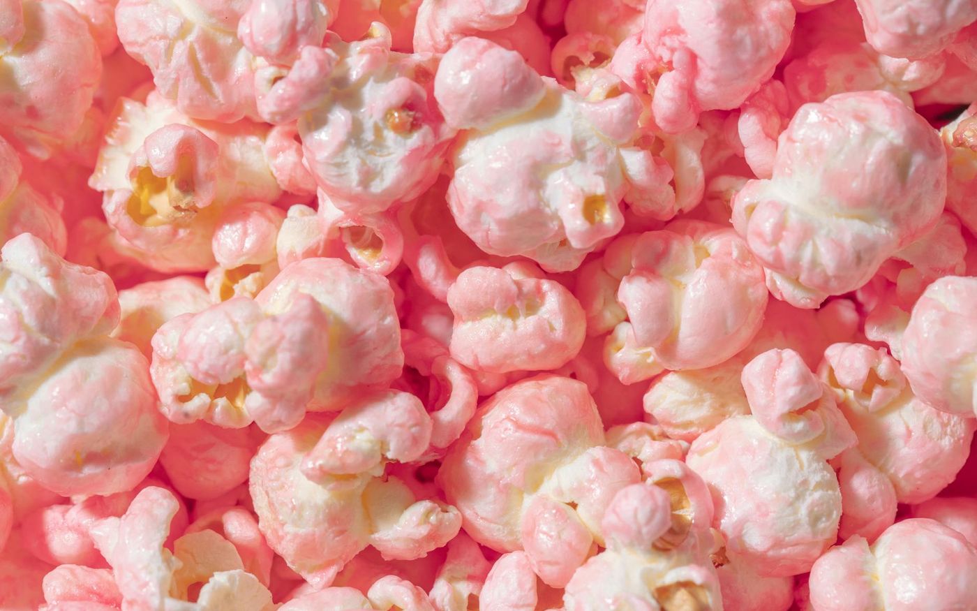 Bowl of gourmet popcorn variety pack in a restaurant setting, representing global snacking trends and market opportunities for food service.