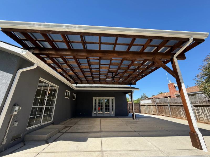 Custom wood patio cover designed to provide shade, natural light, and a clean modern outdoor living space.