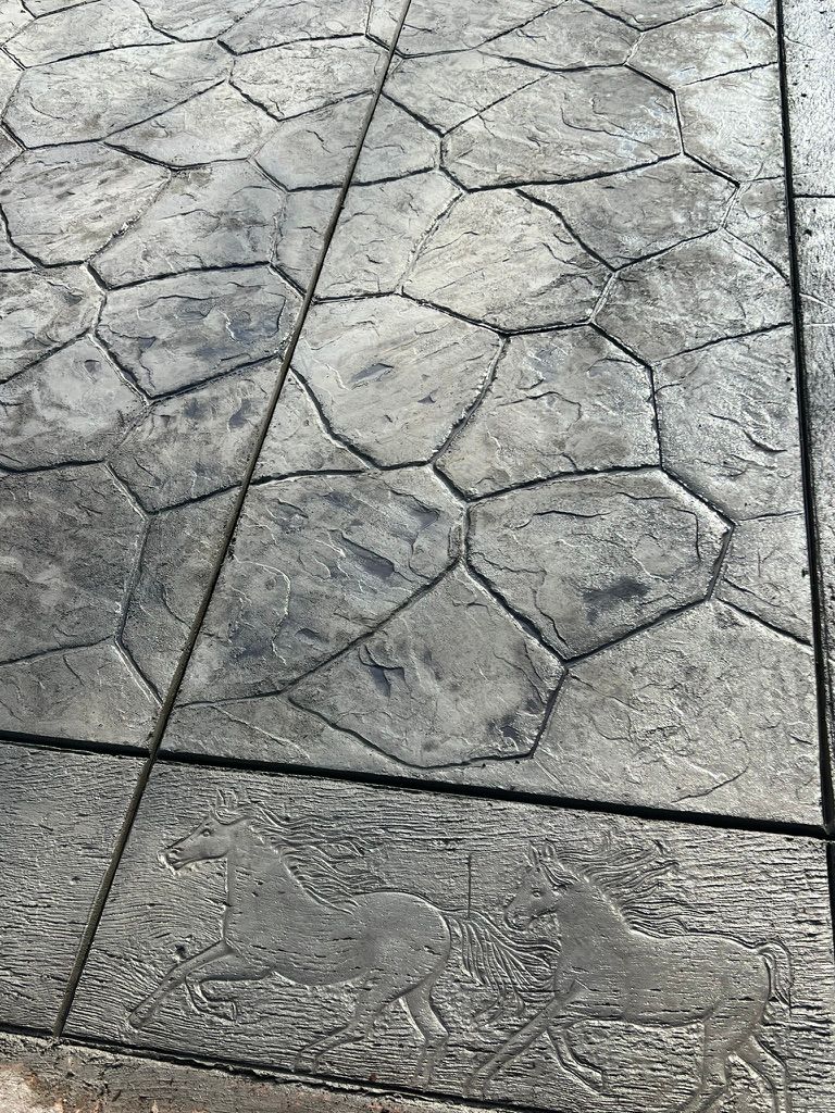 Stamped concrete with flagstone pattern and horse stamp detail