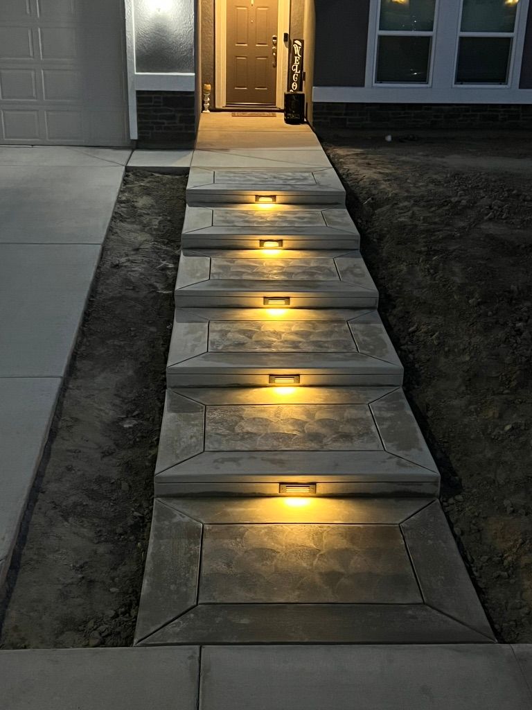 Floating concrete steps with warm embedded lighting
