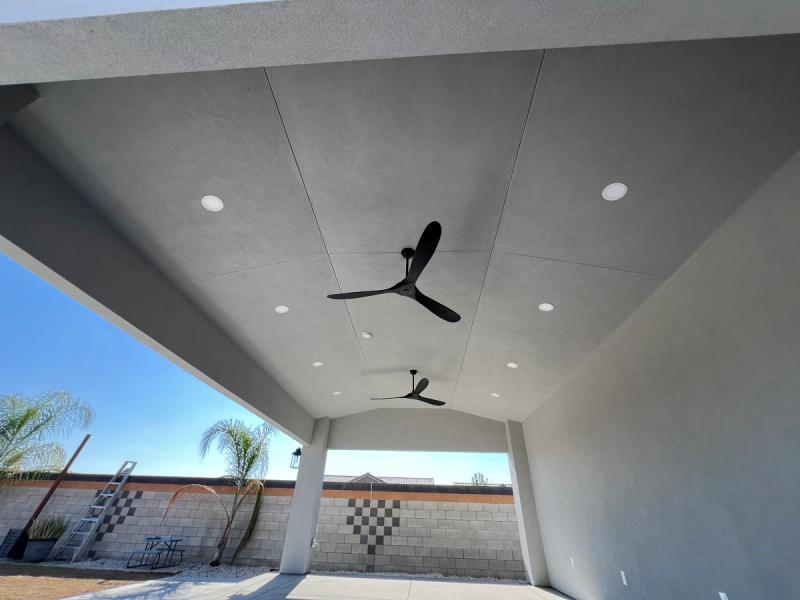 Ceiling with cambered trusses, recessed lights, and ceiling fans - fine acrylic texture finish