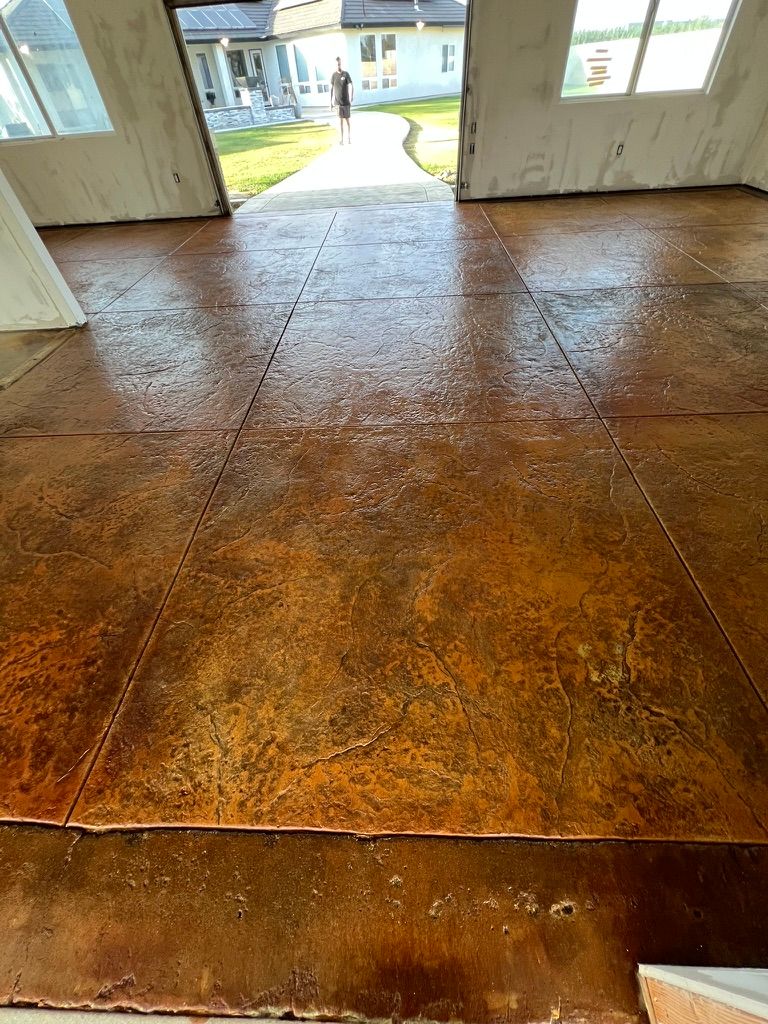Stamped and stained concrete floor with stone pattern