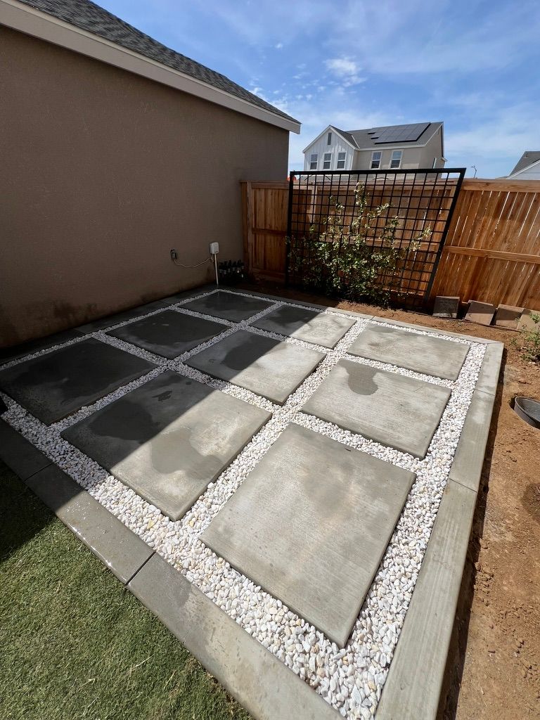 Modern concrete pad grid with white rock fill