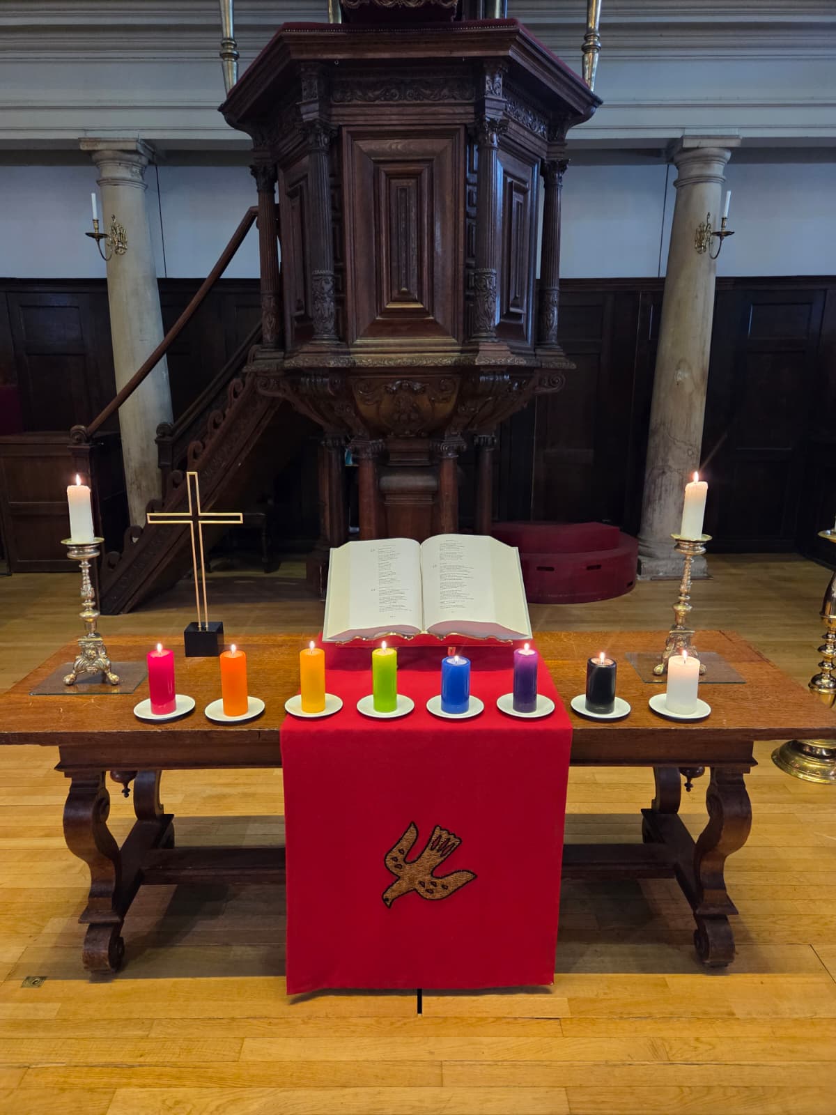 Lutheran Church during the opening of exposition EMBRACE in Amsterdam, with rainbow color candles.
