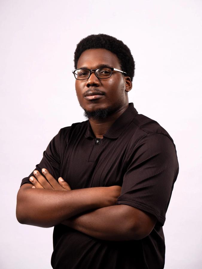 Ebubechukwu Ibeh folding his arms