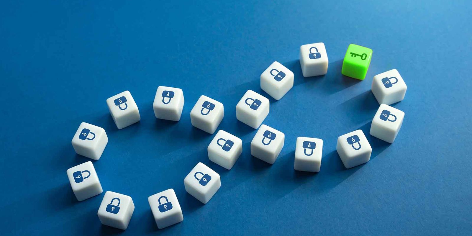 Padlock dice laid out in an infinity loop, with a single green key die