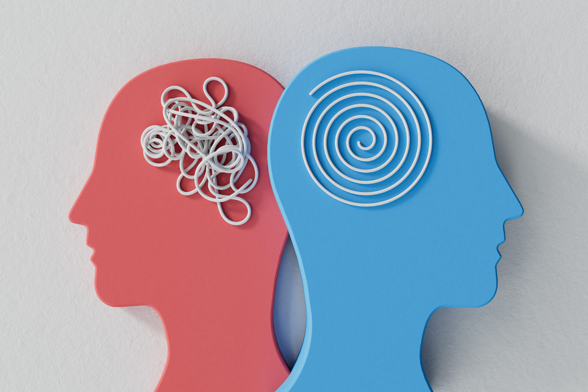 Two head silhouettes, one with a tangled line and one with a neat spiral