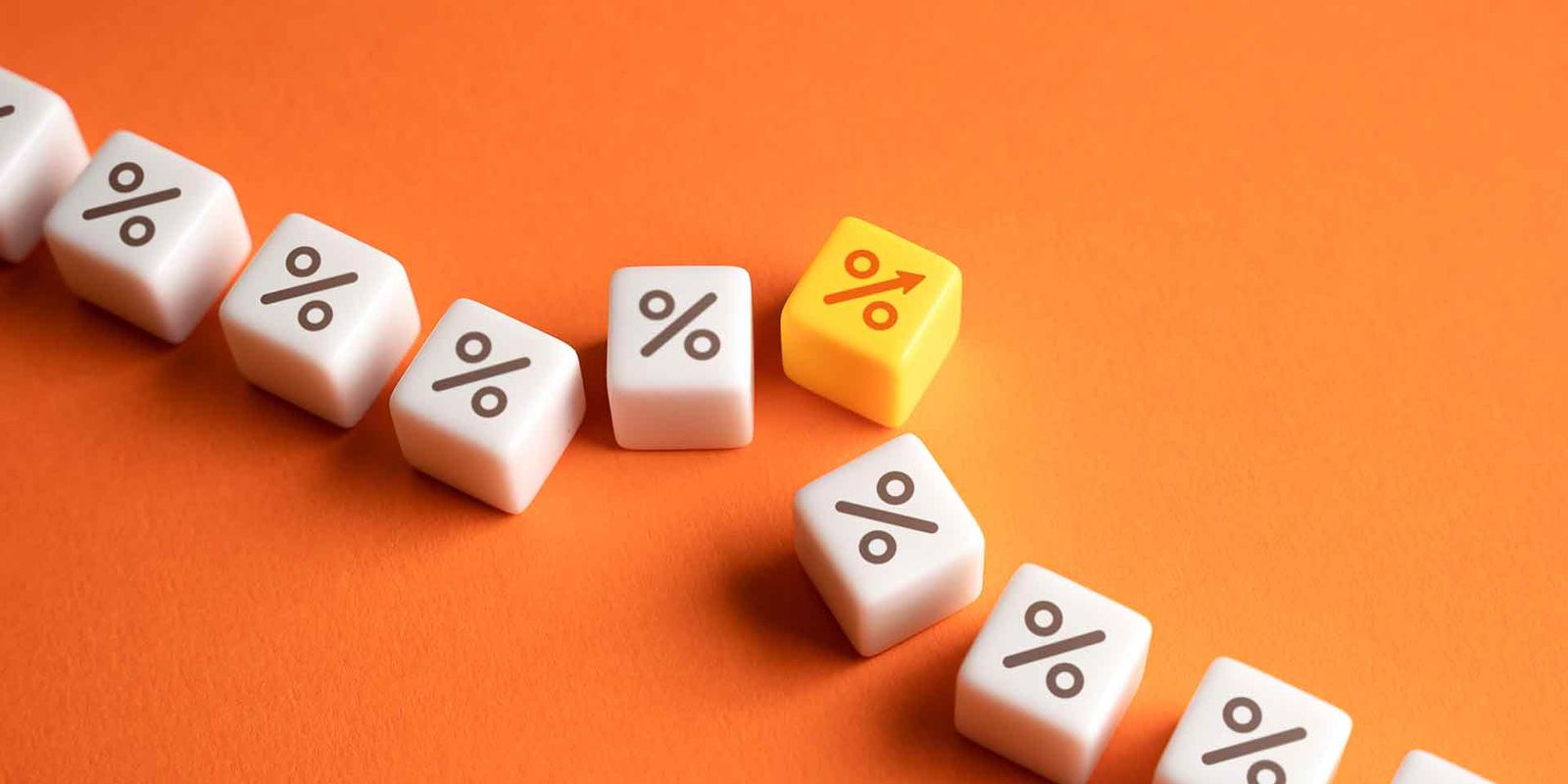 A row of percentage dice with one yellow die breaking out