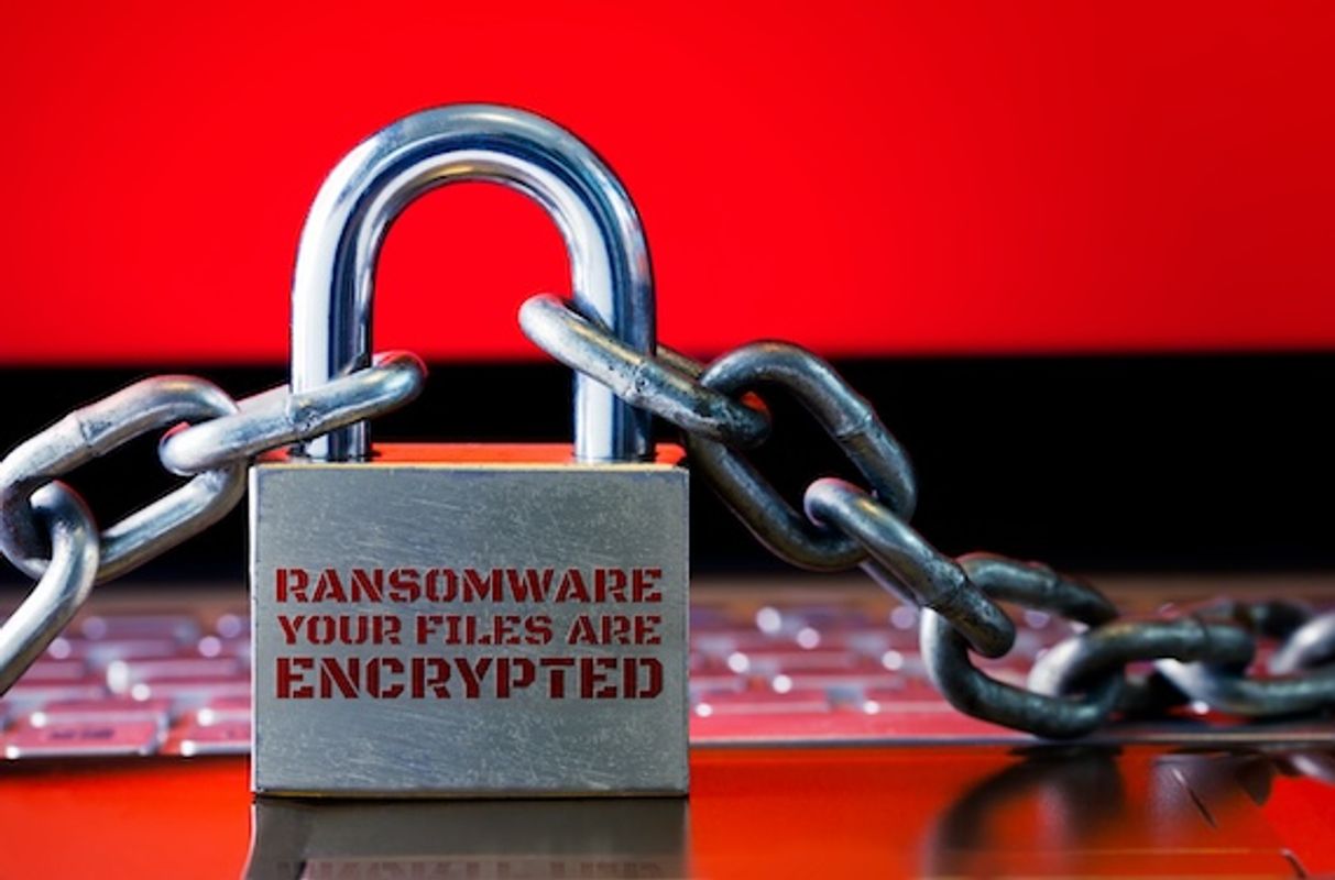 Computer has been blocked access to Data with Ransomware. Can not access Data by Malware, Encrypt and Hacking Conceptual with Padlock. The Old padlock and Chains On Laptop with Red Screen.