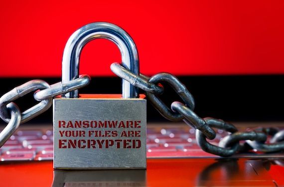 Computer has been blocked access to Data with Ransomware. Can not access Data by Malware, Encrypt and Hacking Conceptual with Padlock. The Old padlock and Chains On Laptop with Red Screen.