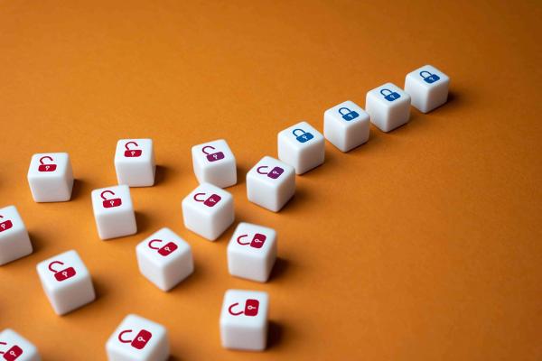 Padlock dice, the scattered ones unlocked and a neat row locked