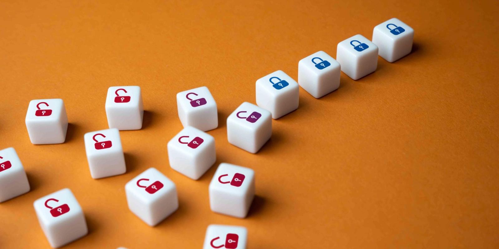 Padlock dice, the scattered ones unlocked and a neat row locked