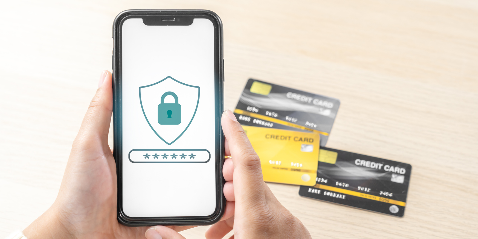 Credit cards and padlock on phone screen