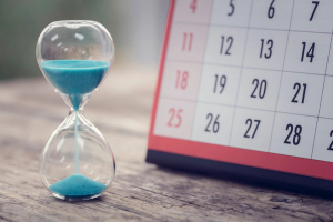 Hour glass and calendar important appointment date