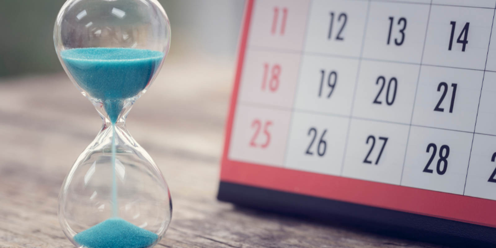 Hour glass and calendar important appointment date