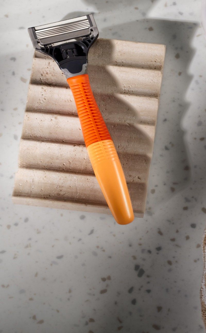 Ember Harry's Original Handle on beige textured surface