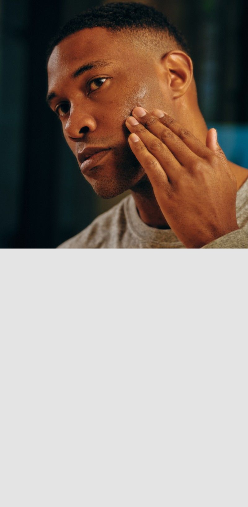 Man applying product to cheek with his fingers