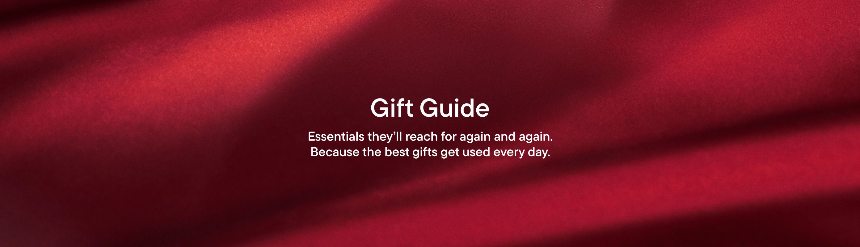"Gift Guide, Essentials they'll reach for again and again. Because the best gifts get used everyday." on red background