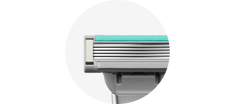 Close up of blue lubrication strip on Harry's Plus razor cartridge