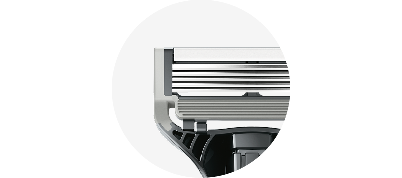 Close-up of white lubrication strip on razor cartridge