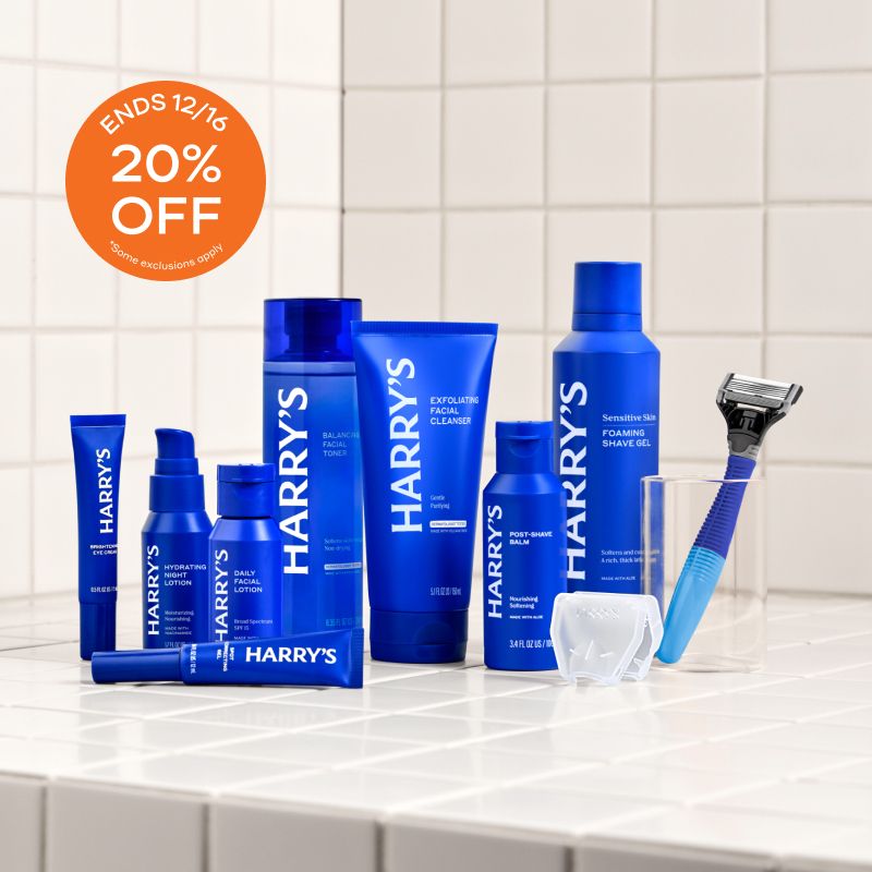 Blue Harry's products on white tiled bathroom shelf with 20% off orange buble in corner