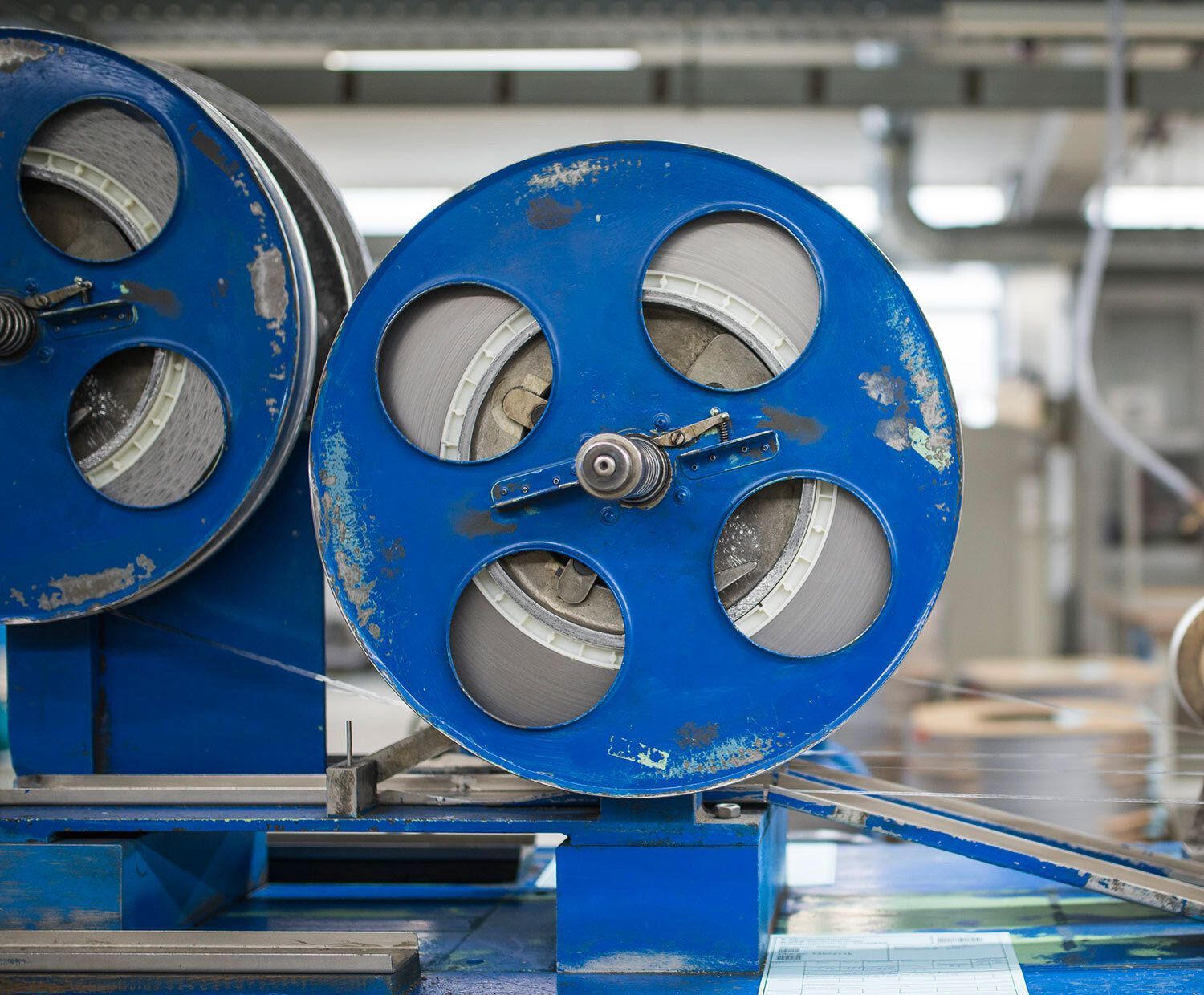 Close up of a blue piece of factory equipment in the Harry's Factory.