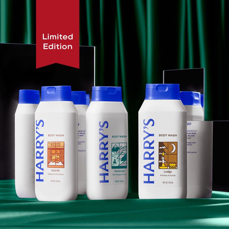 3 Harry's Limited Edition White Body Wash Bottles on green background.
