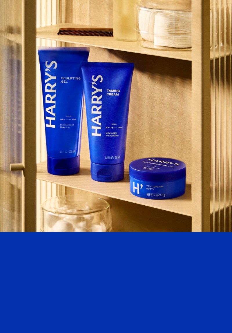 Sculpting Gel, Taming Cream and Texturizing Putty on wooden shelf