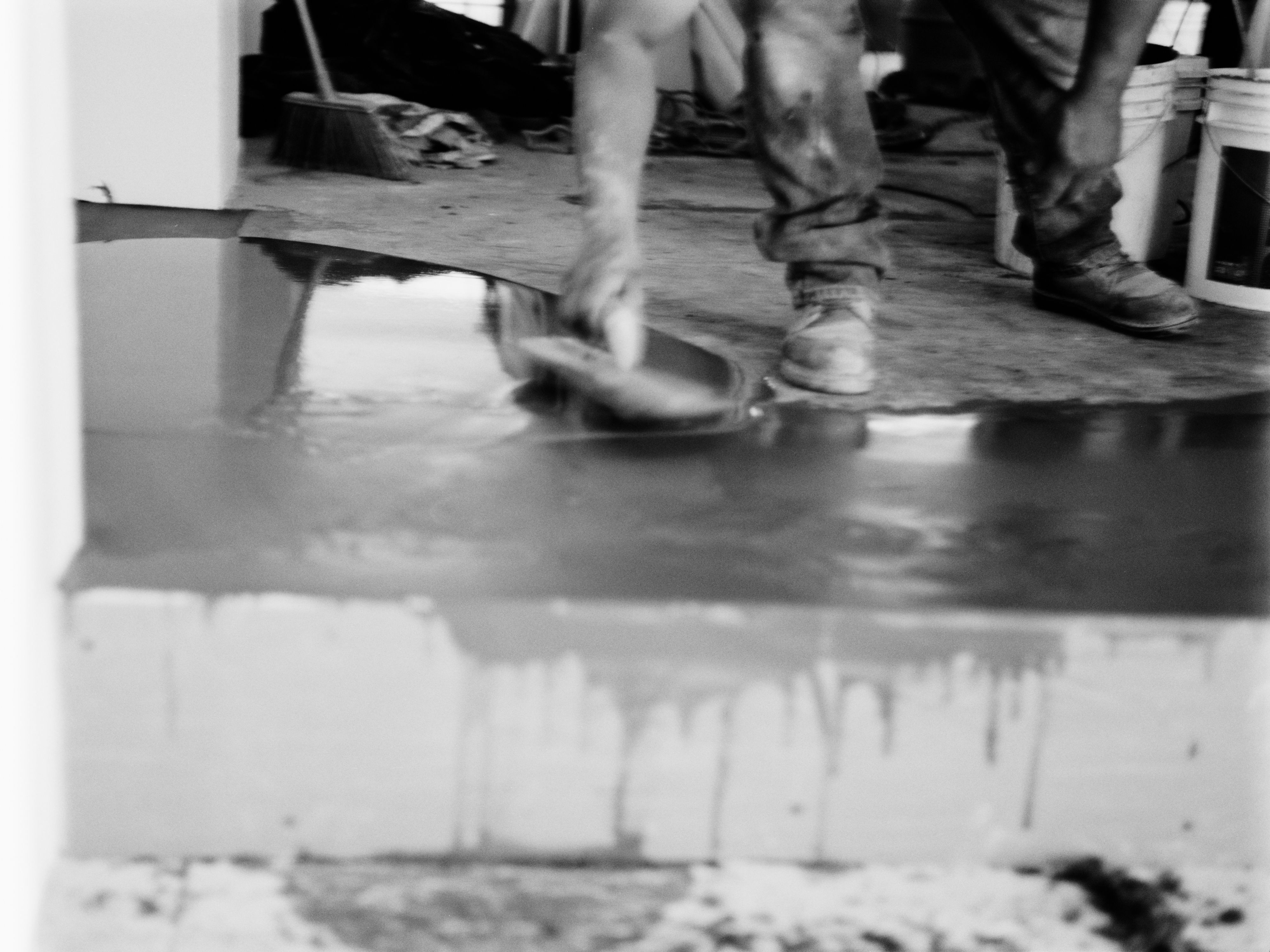 a bucket pouring out dark liquid onto the ground, WOE, Width Over Ears