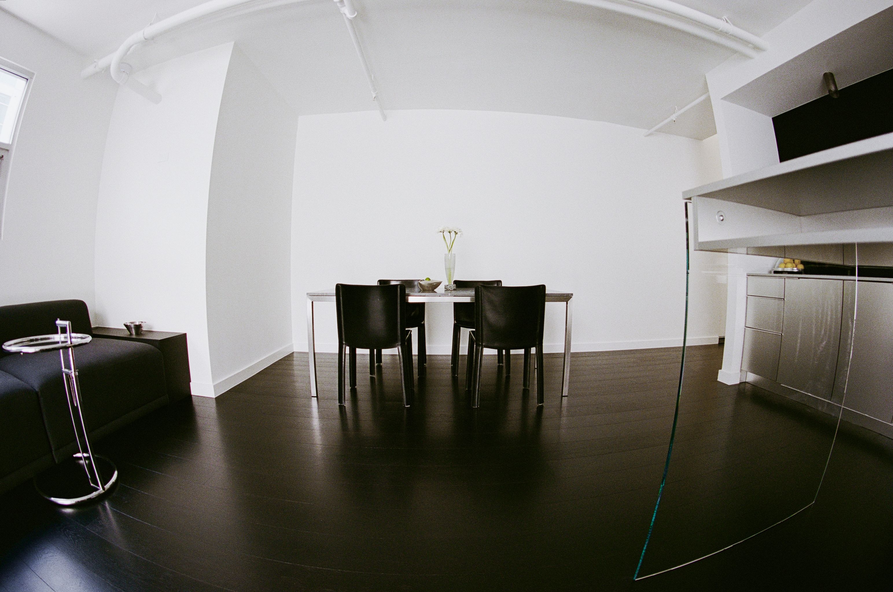 silver kitchen cabinetry with leather sink skirt