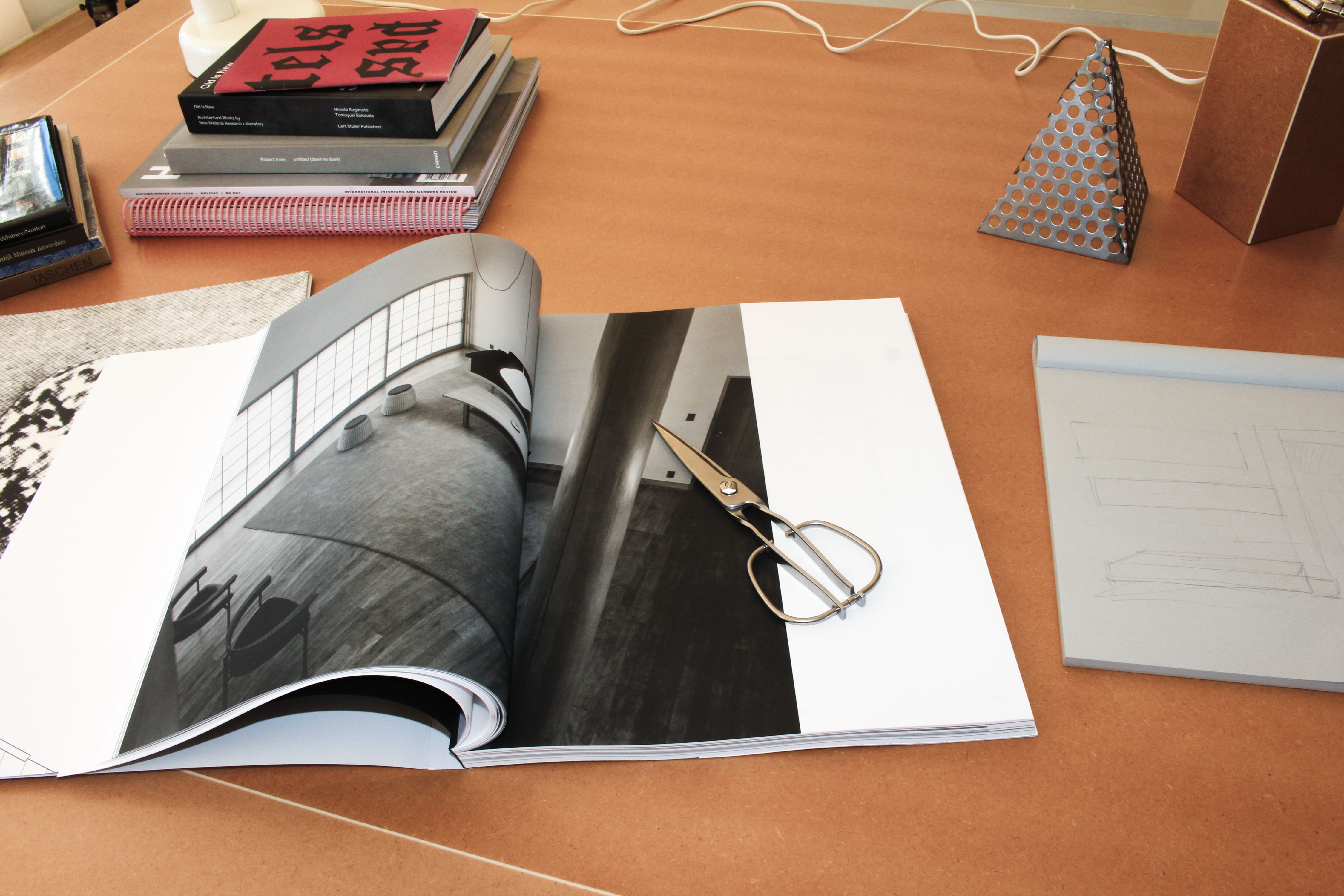a tabletop with various books and materials scattered across it