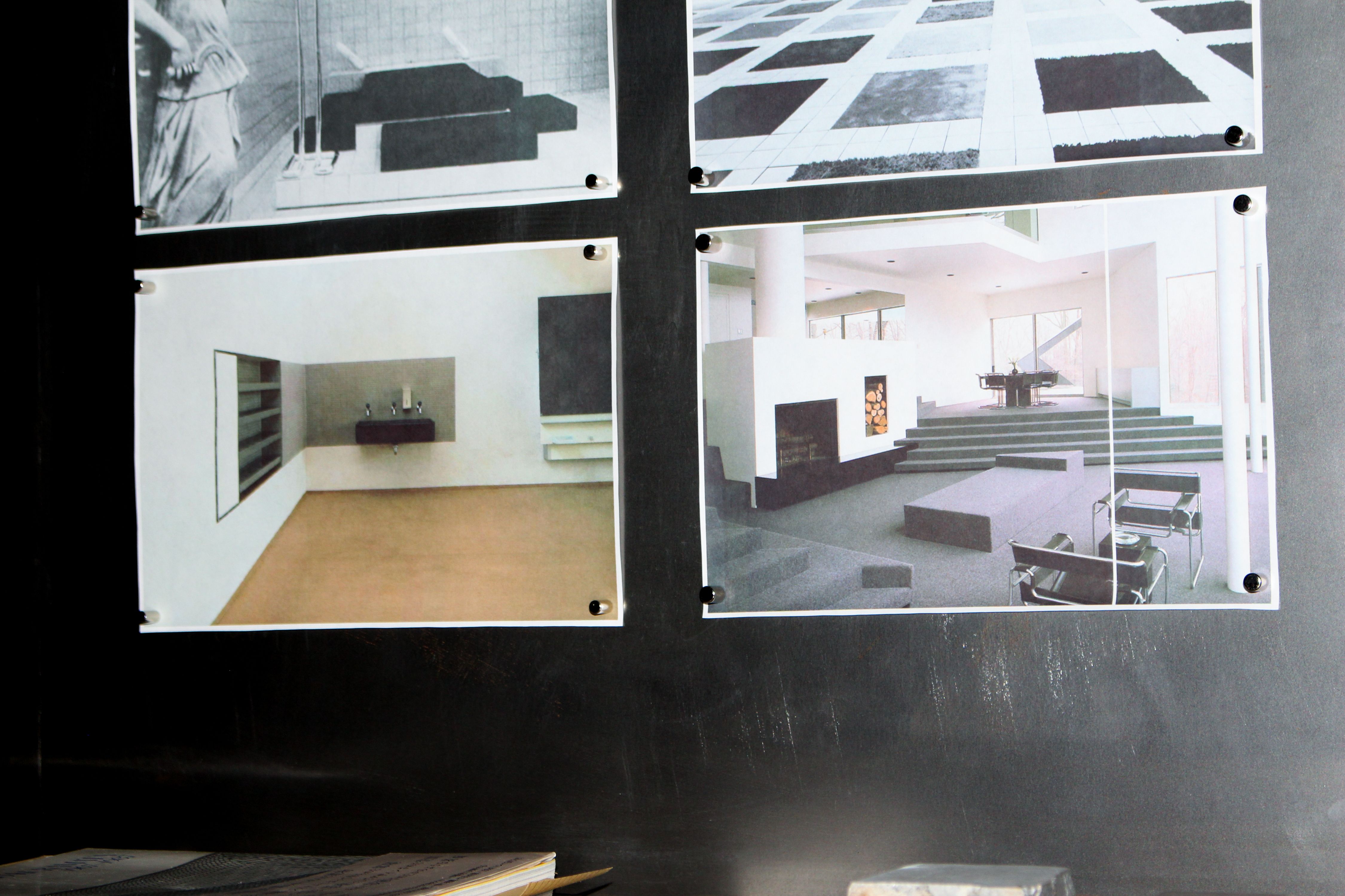 a metal wall with various images pinned to it, WOE, Width Over Ears