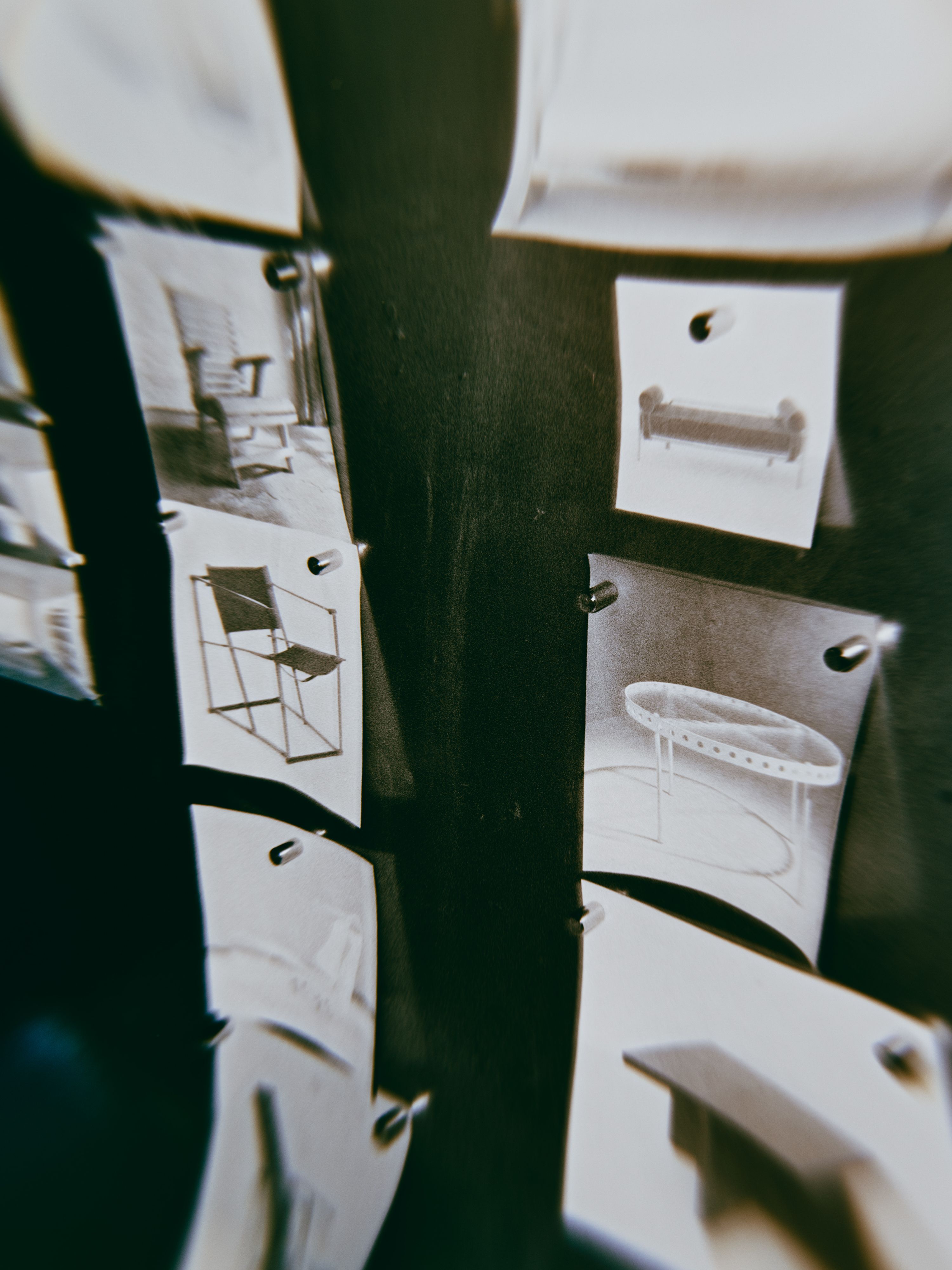 a distorted image of pieces of furniture printed on white paper, WOE, Width Over Ears