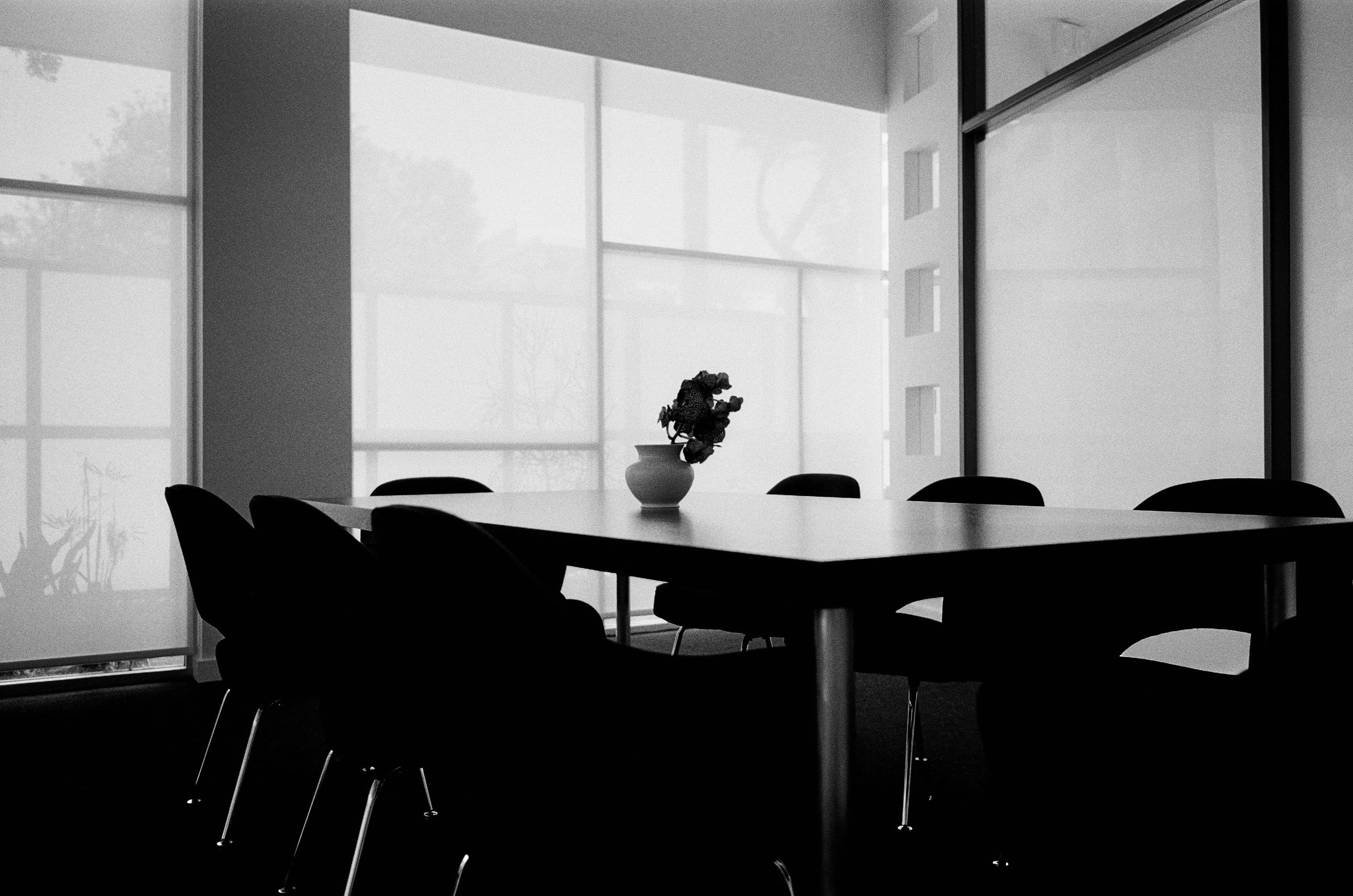 a black and white image of a conference room 