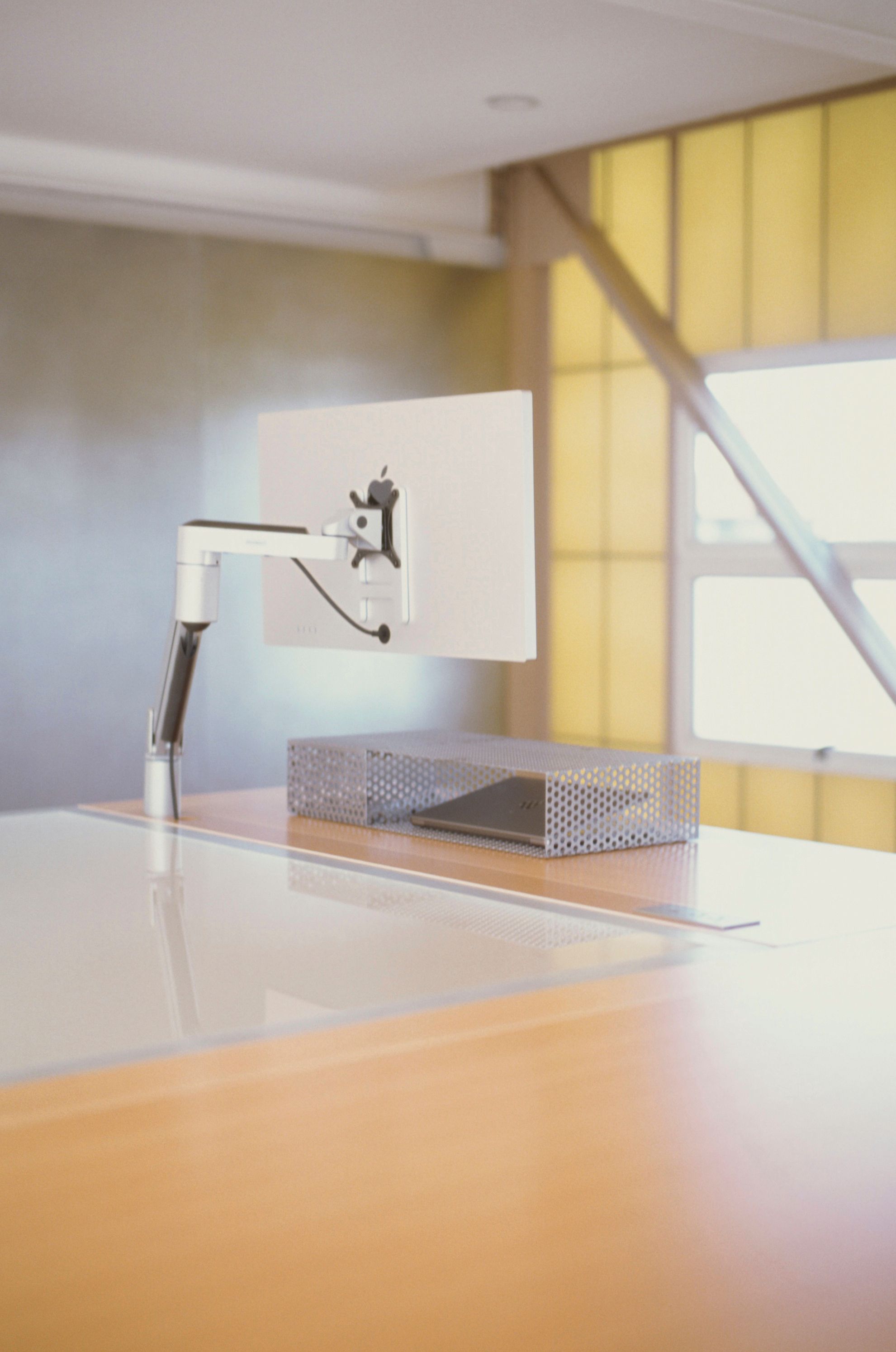 metal keyboard riser box on a desk