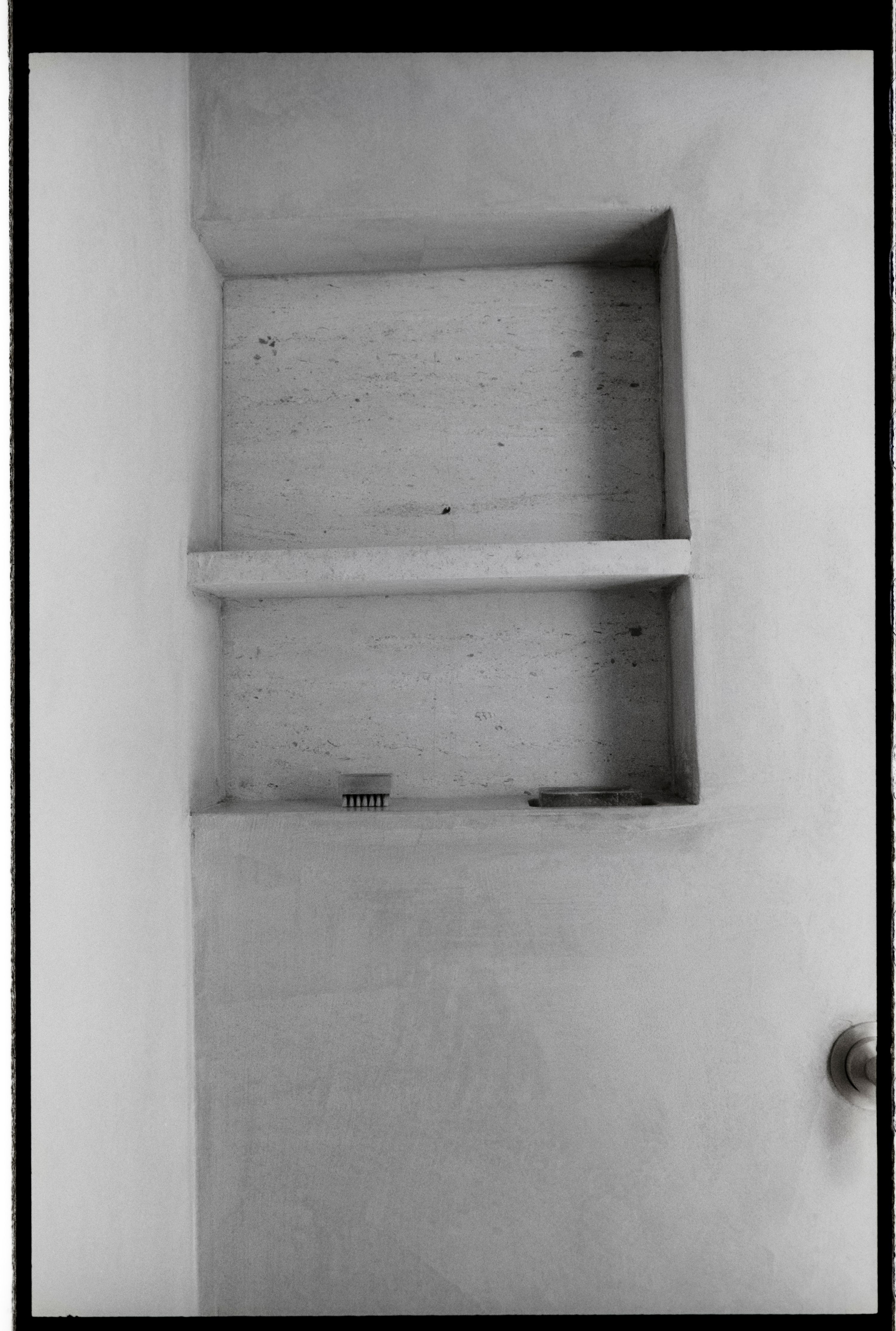 a black and white image of a shower niche, WOE, Width Over Ears