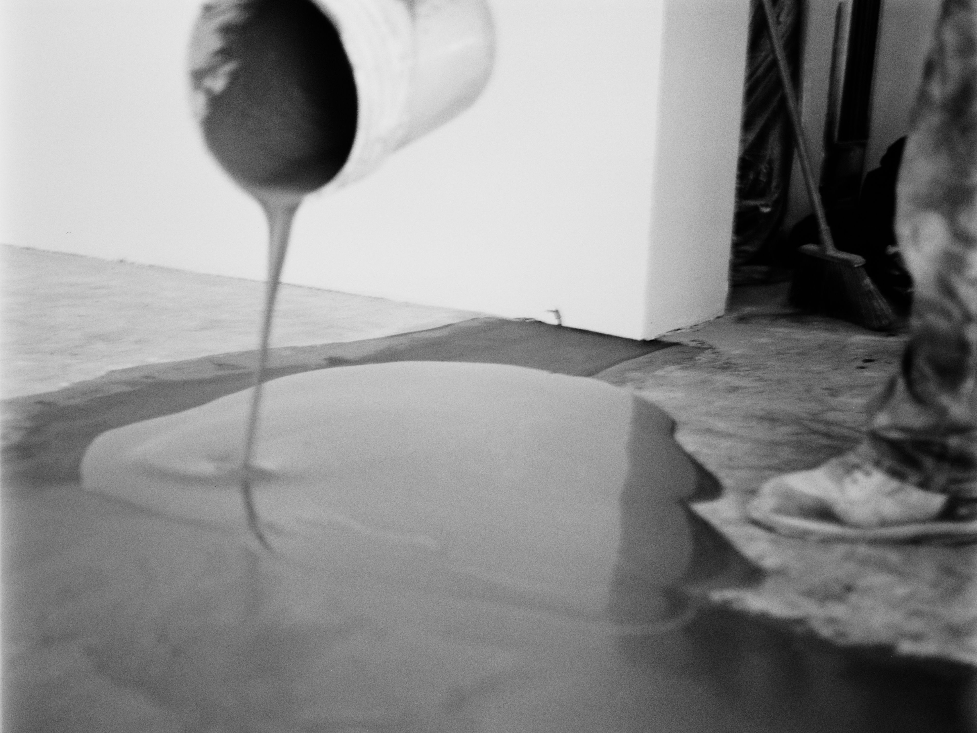 a bucket pouring out dark liquid onto the ground, WOE, Width Over Ears