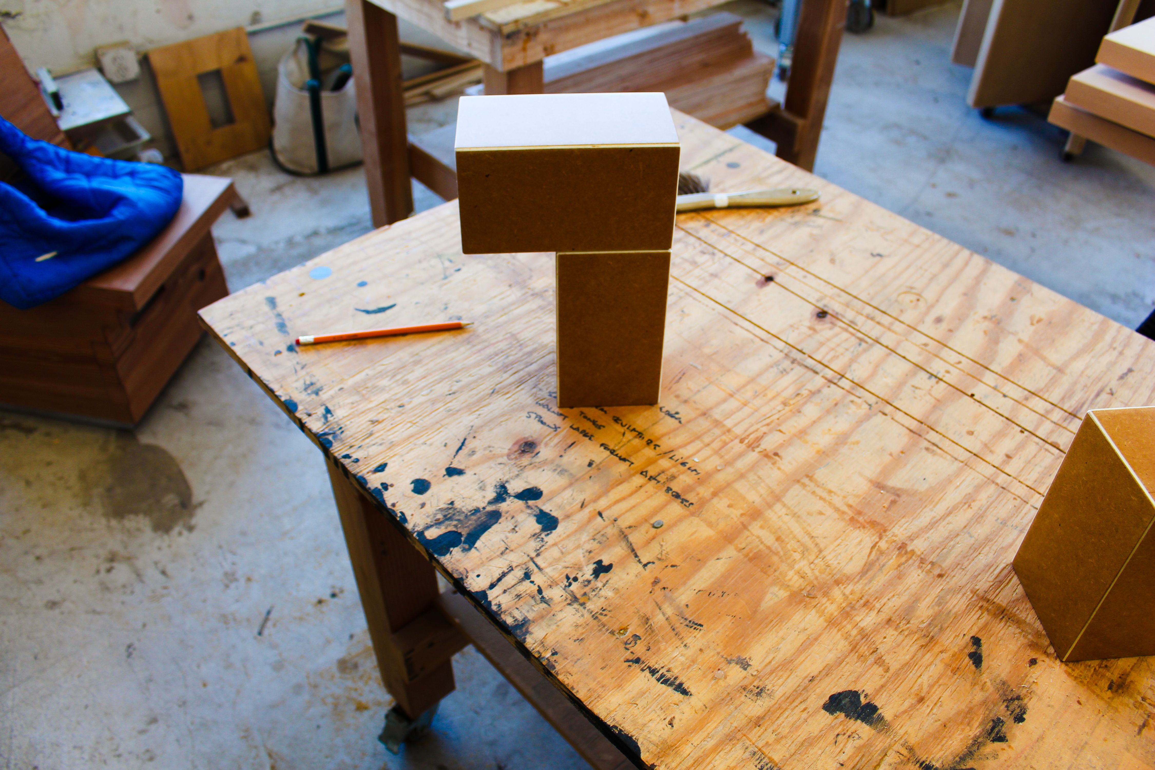 stacked blocks of MDF on a worktable, WOE, Width Over Ears