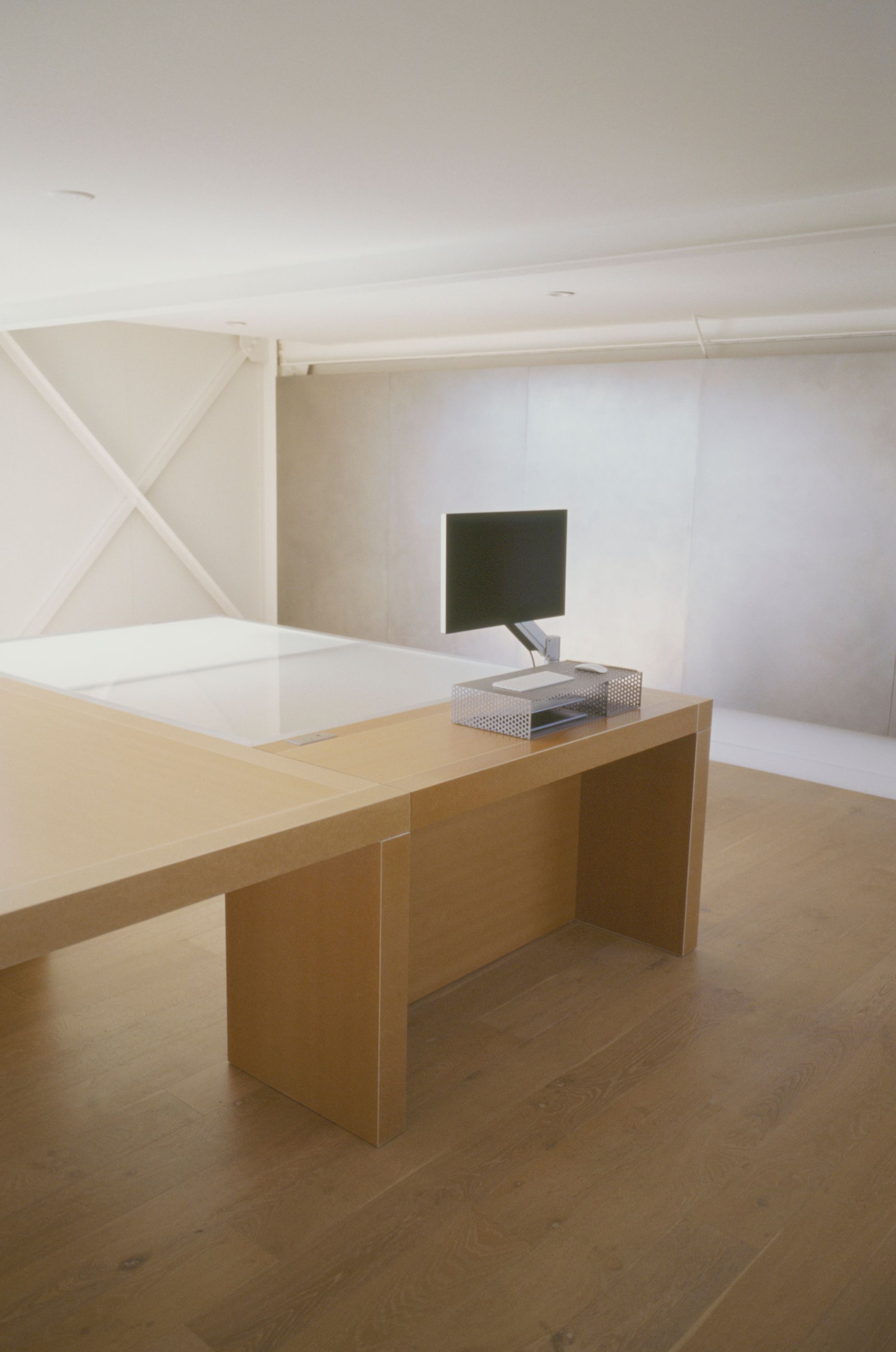 a large pair of nesting tables in a room with wooden floors