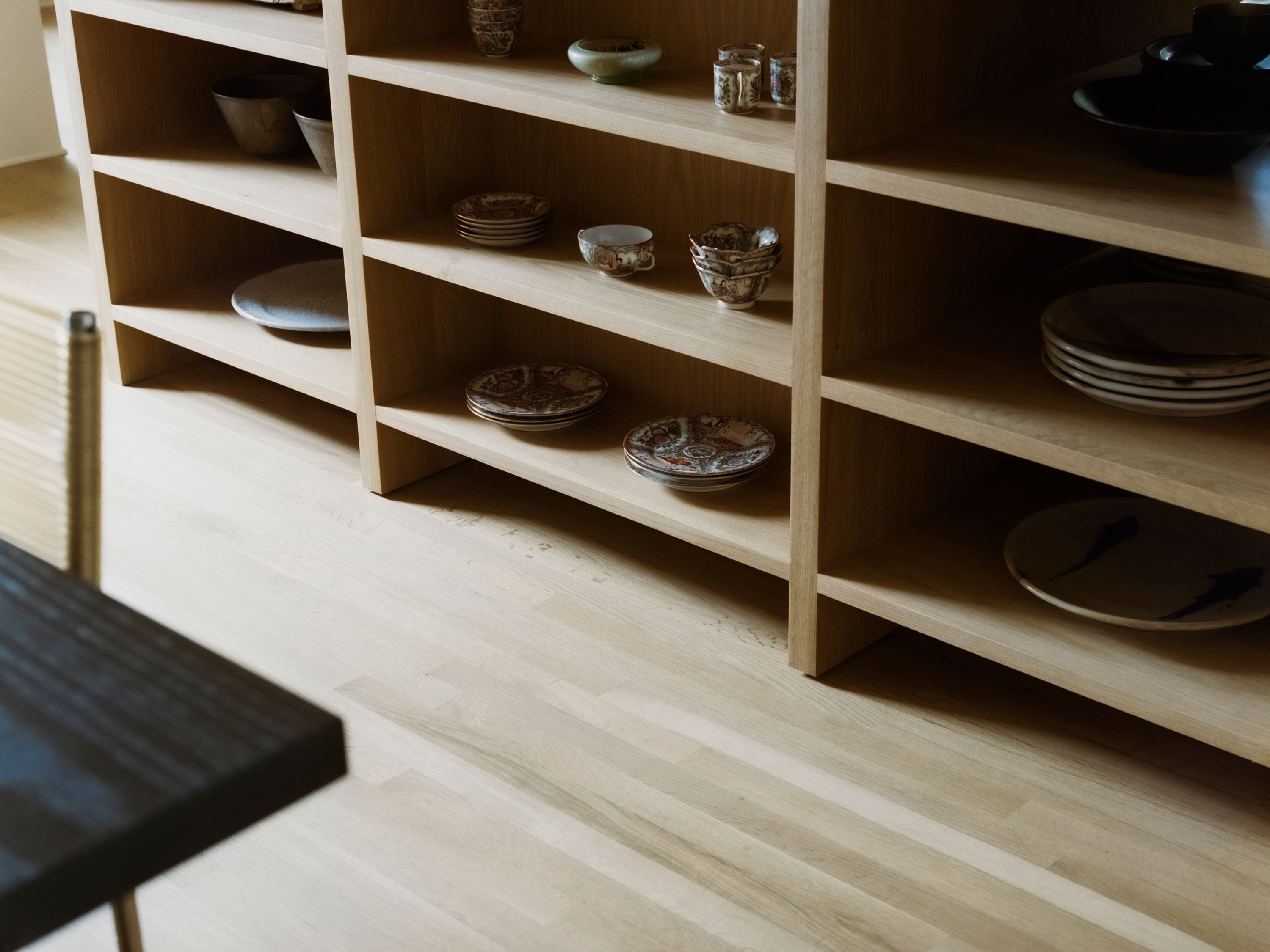 wooden kitchen island with storage shelves and ceramics, woe, width over ears