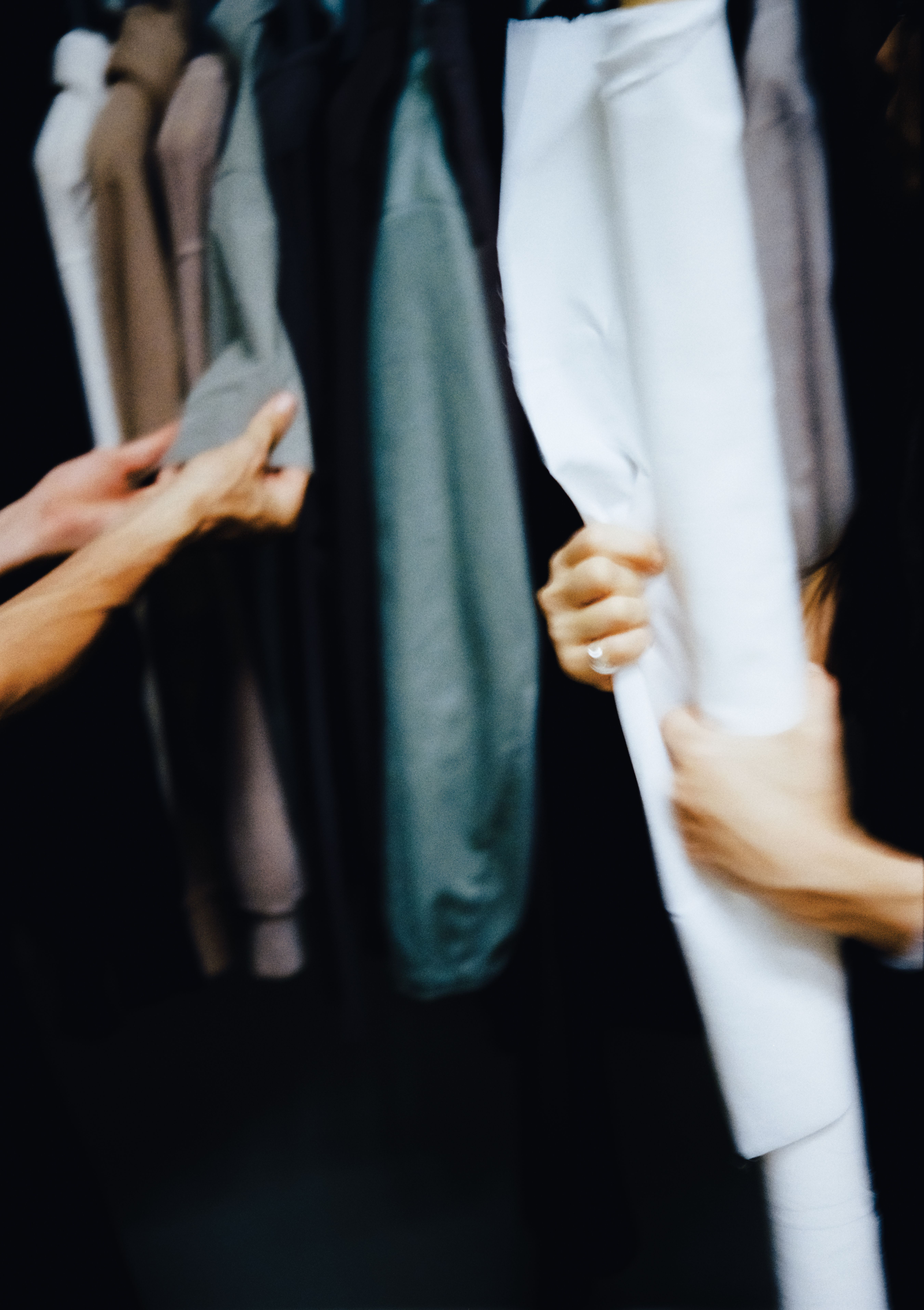 two people holding hanging fabrics, WOE, Width Over Ears