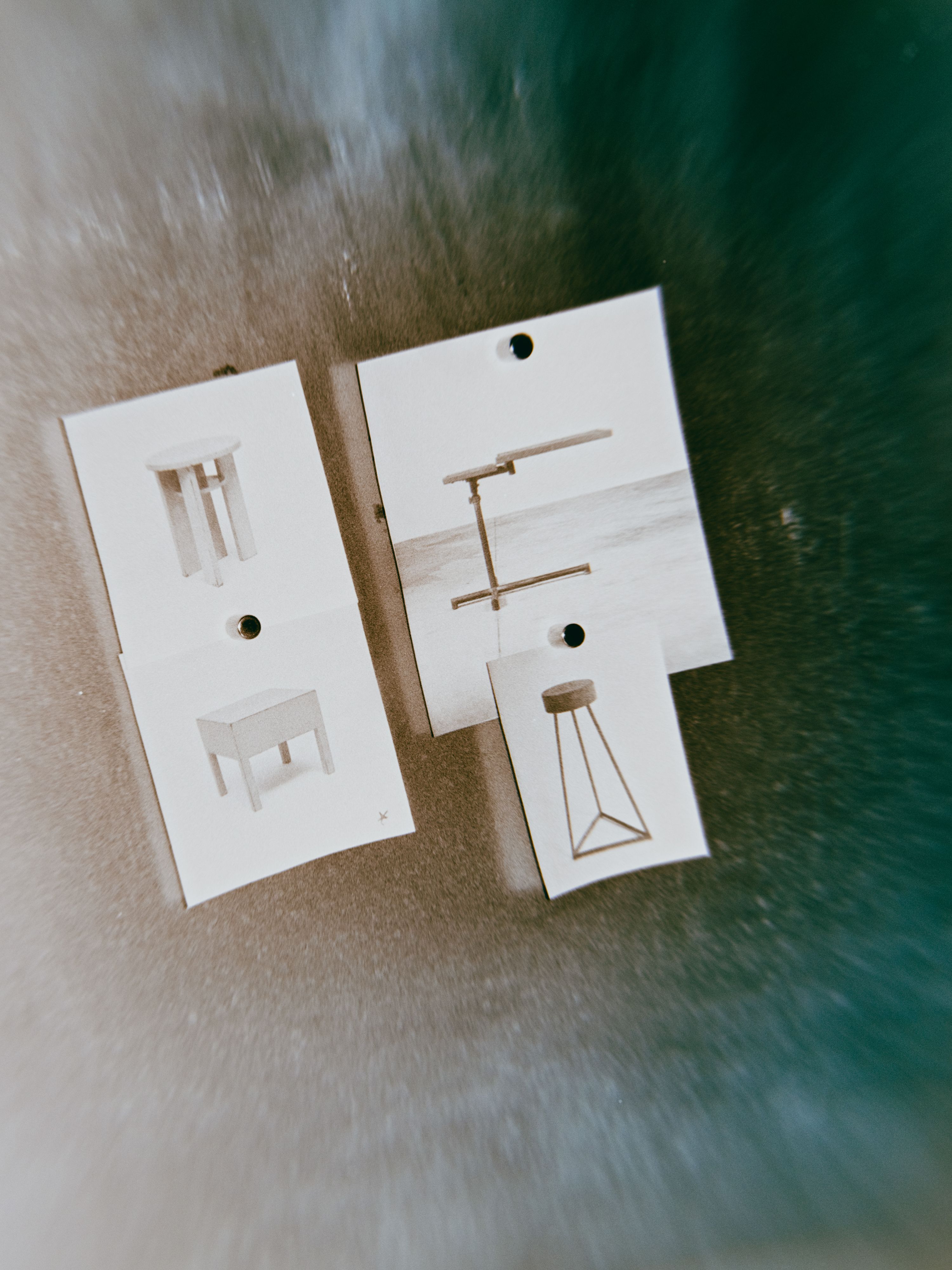 a distorted image of pieces of furniture printed on white paper, WOE, Width Over Ears