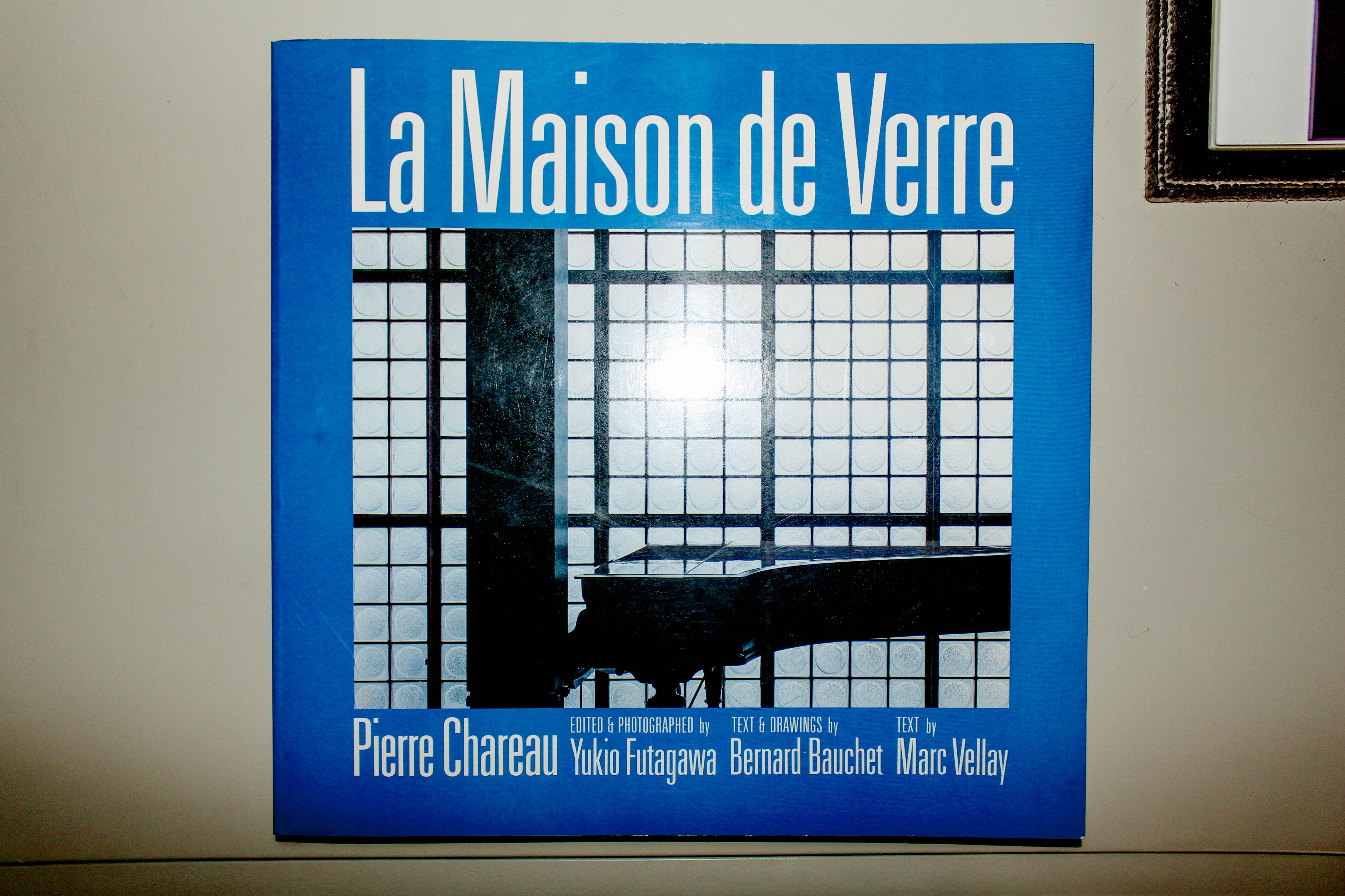 a photo of a blue book on an oak table, WOE, Width Over Ears