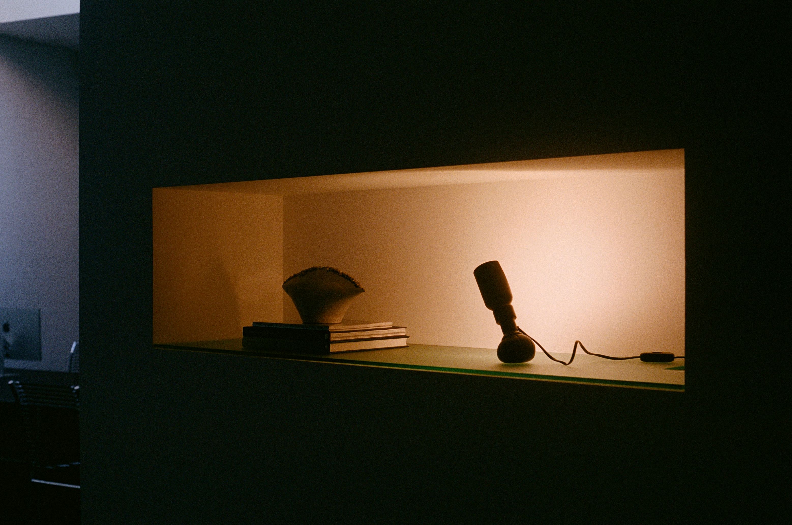 a box lit by orange light with shapes inside it