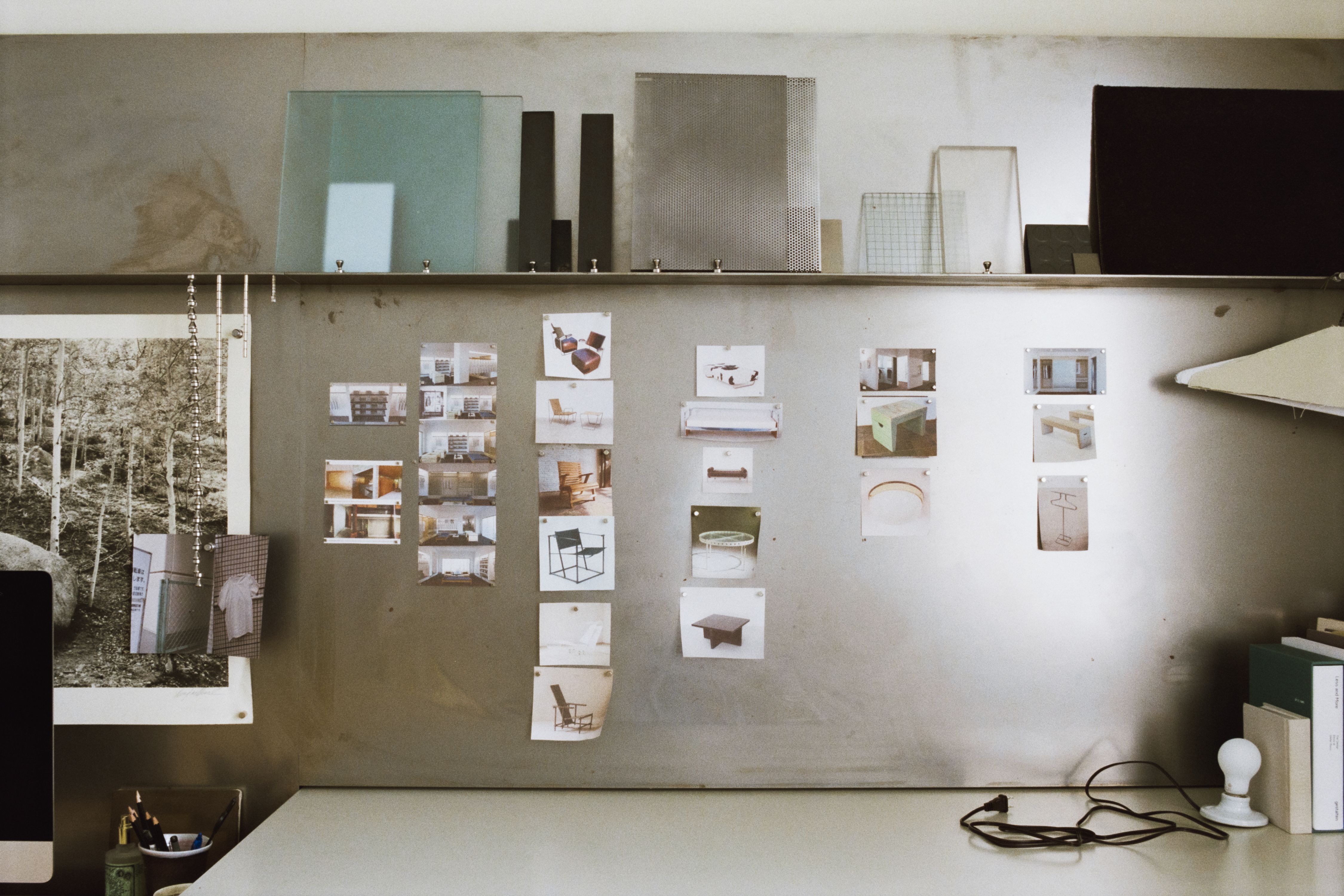 a wall of steel with various images and materials displayed, WOE, Width Over Ears