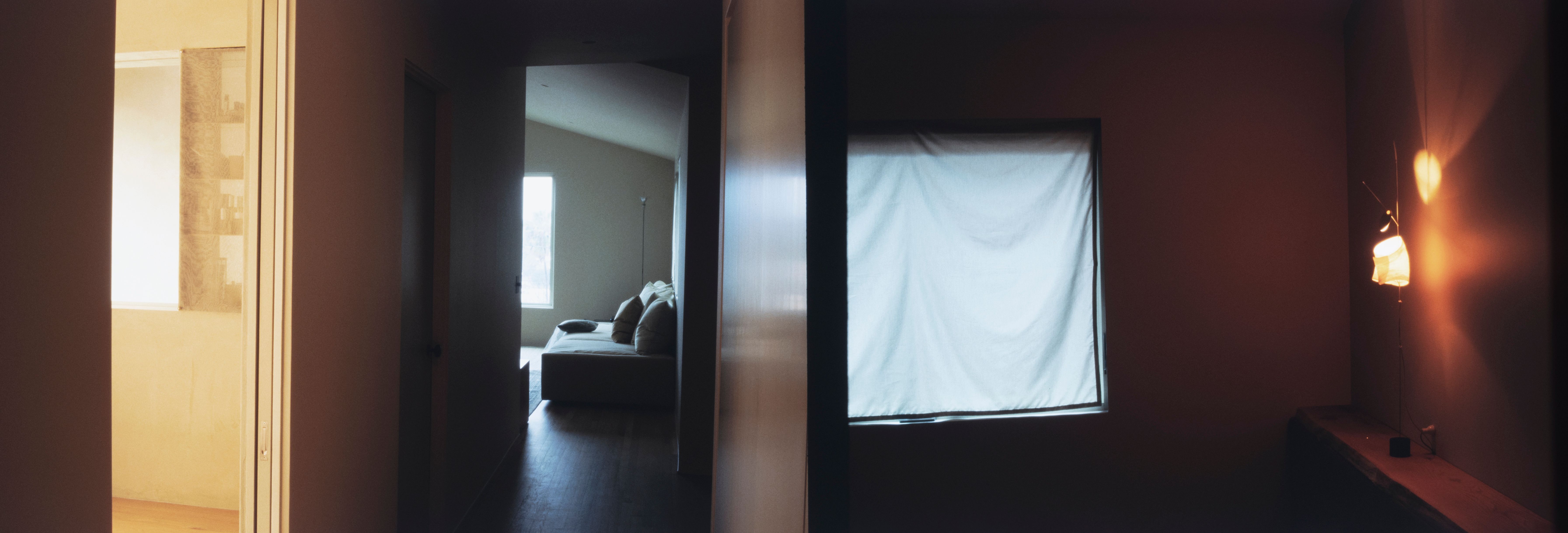 a long image of a sofa, window, and table lamp, WOE, Width Over Ears