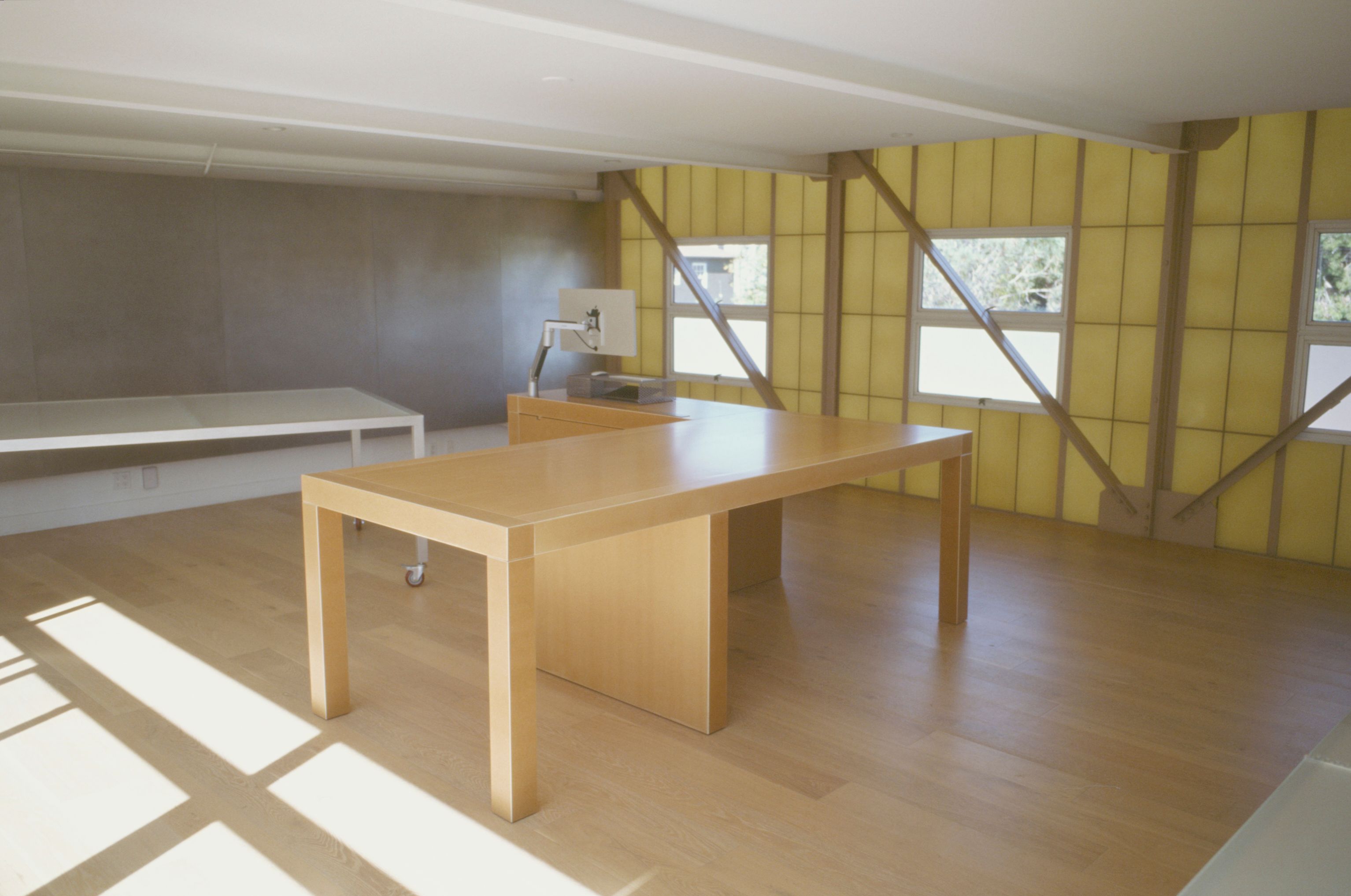 a large pair of nesting tables in a room with wooden floors
