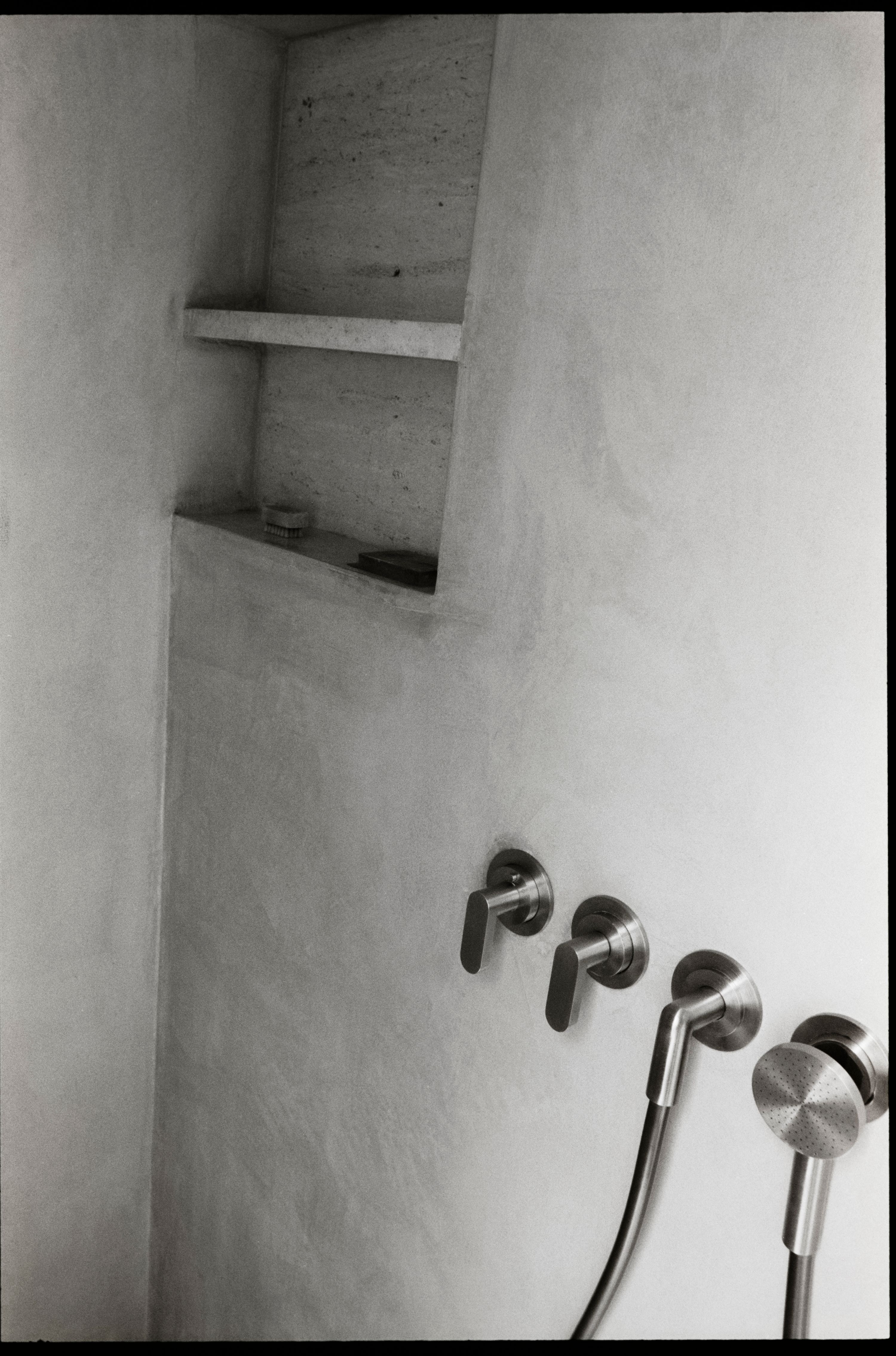 a black and white image of a shower niche, WOE, Width Over Ears