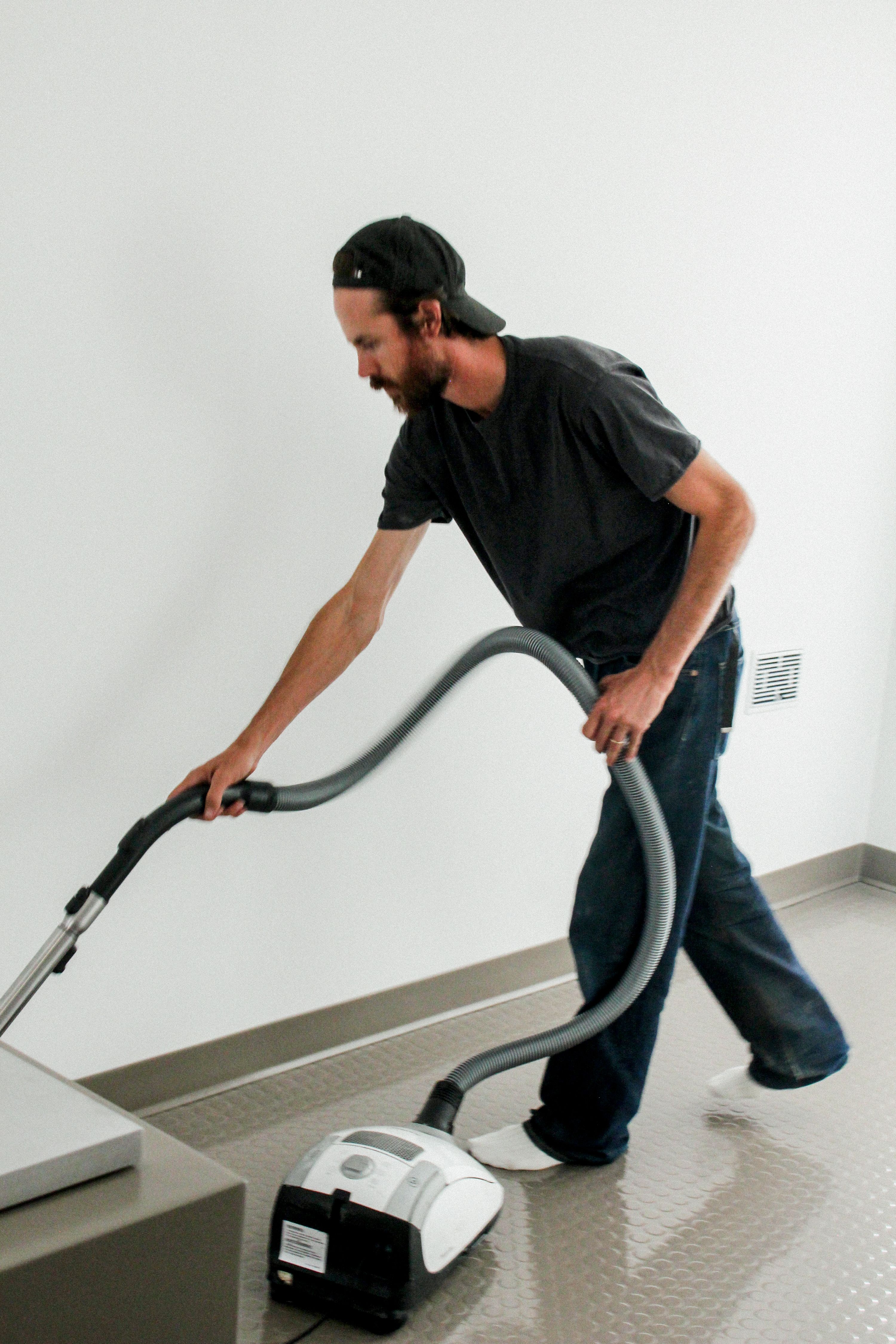a man with a backwards hat vacuuming, WOE, Width Over Ears