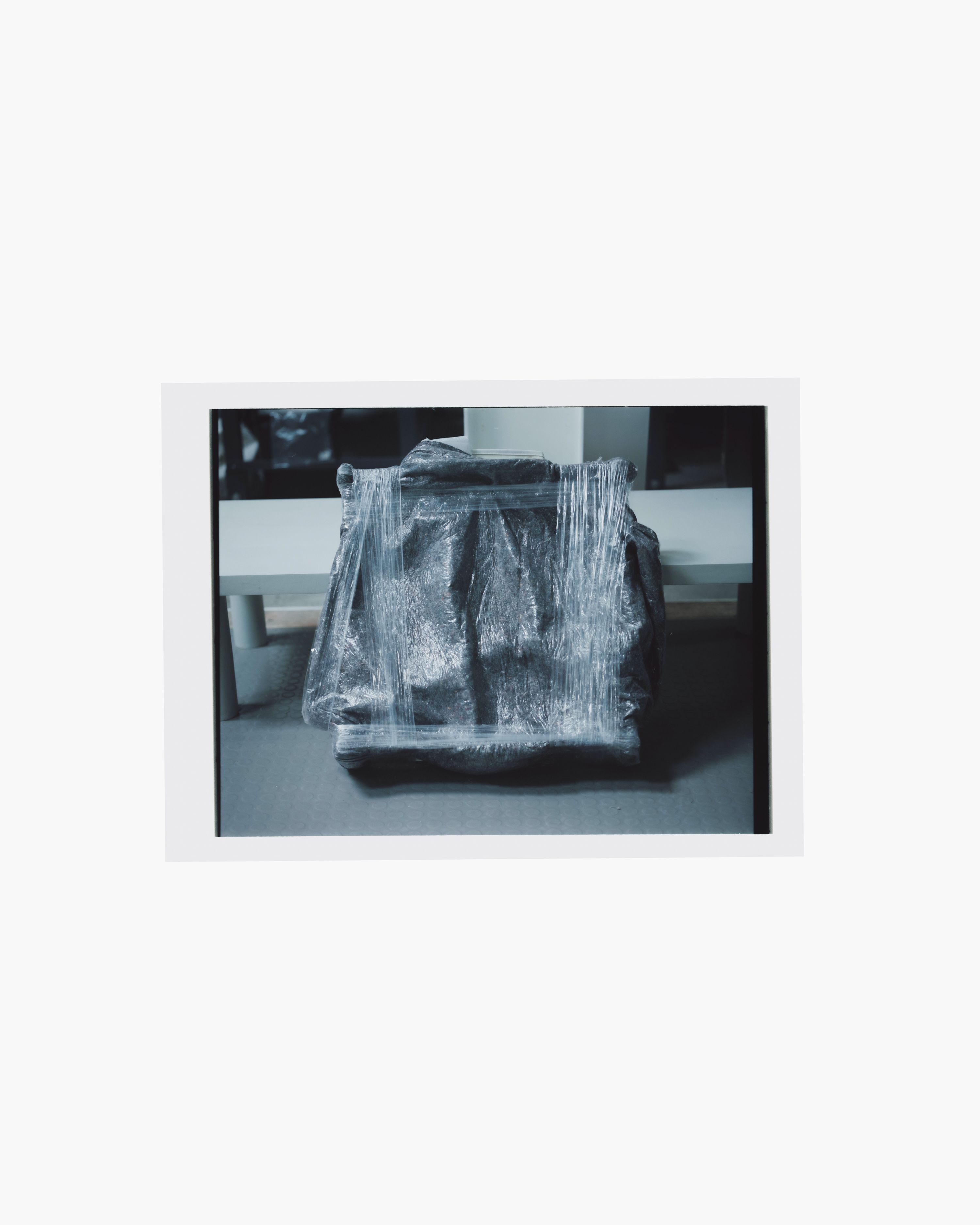 a piece of furniture wrapped in plastic wrap, WOE, Width Over Ears